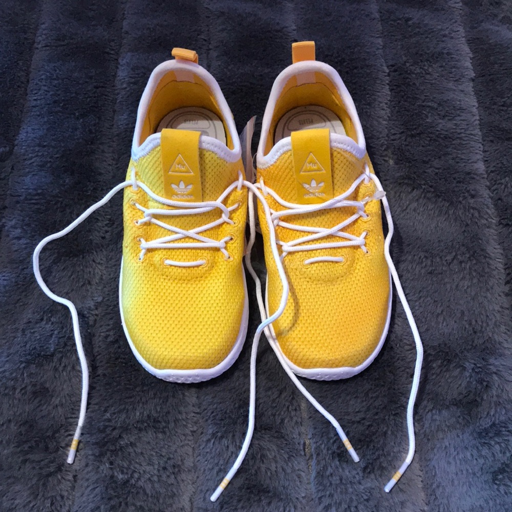 Pharrell Williams and adidas tennis shoes.
